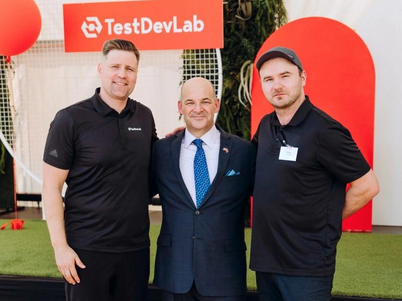 Company CEOs posing for a photo with U.S. Ambassador to Latvia, Christopher Robinson.