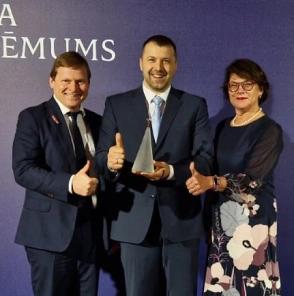 Company's Business Developer receiving the 'Riga ICT Sector Company of the Year' award.