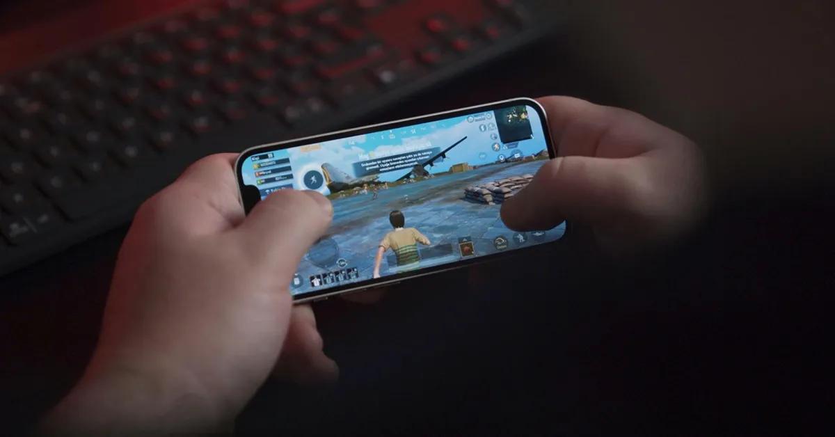 Person playing game on smartphone