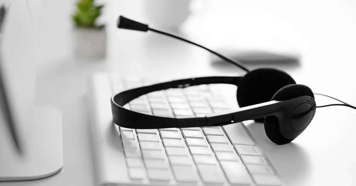 Headphones placed on top of keyboard