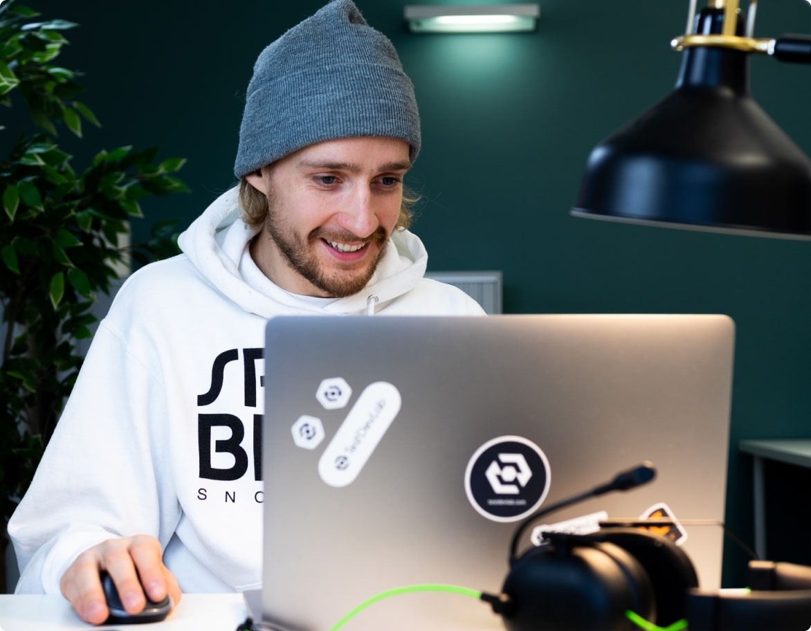 Software testing engineer enthusiastically working on a project.