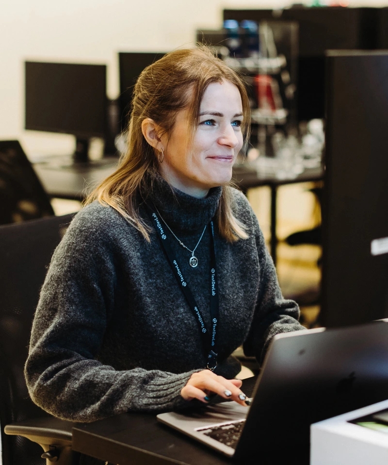 ISTQB certified QA engineer focusing on test strategy development at her workspace