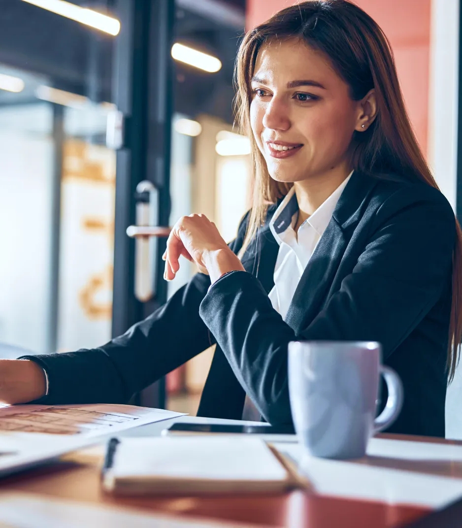 A woman smiling at the desk