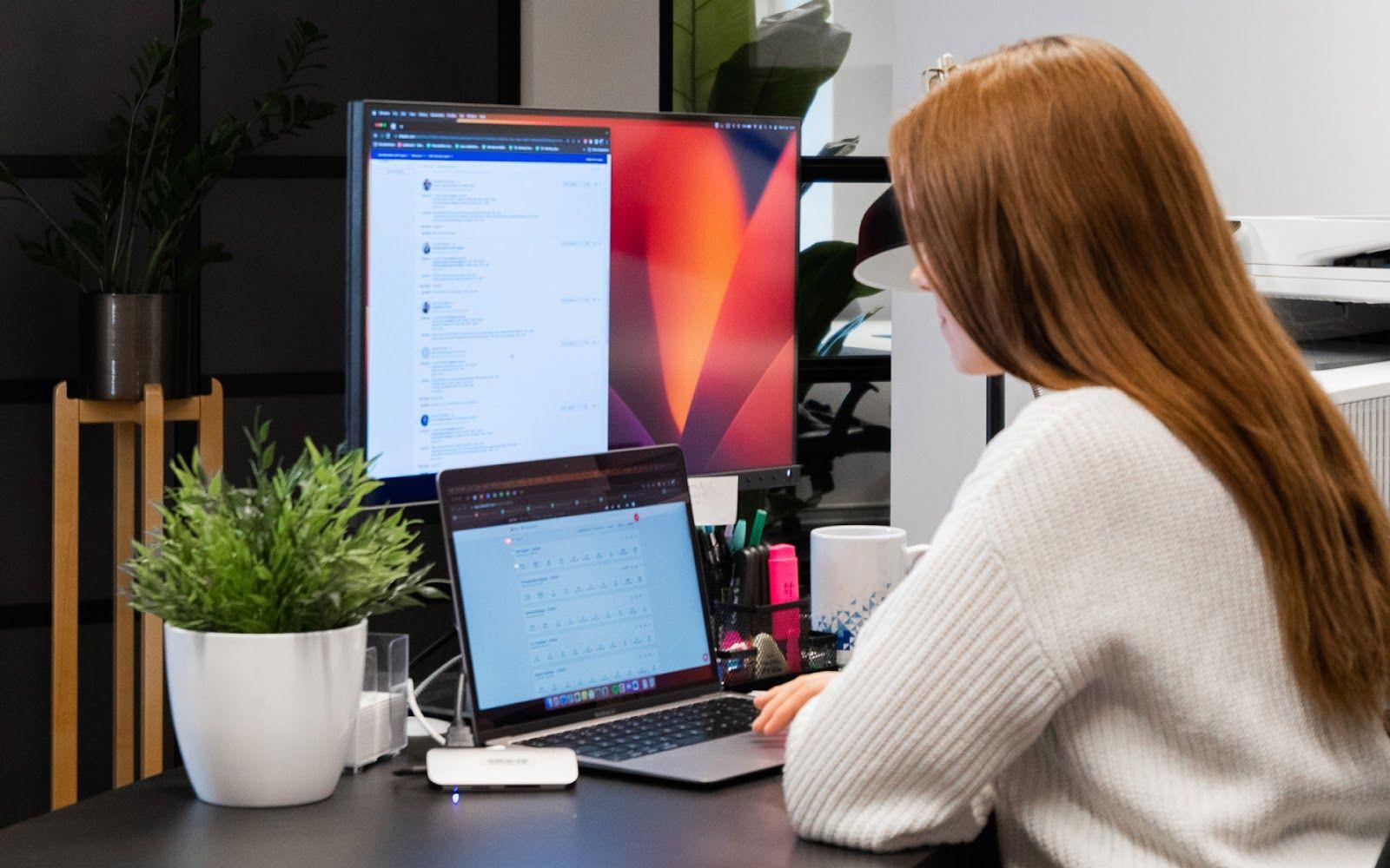 Woman is working on a computer.
