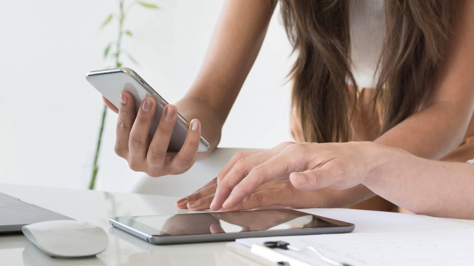 A woman holding her smartphone