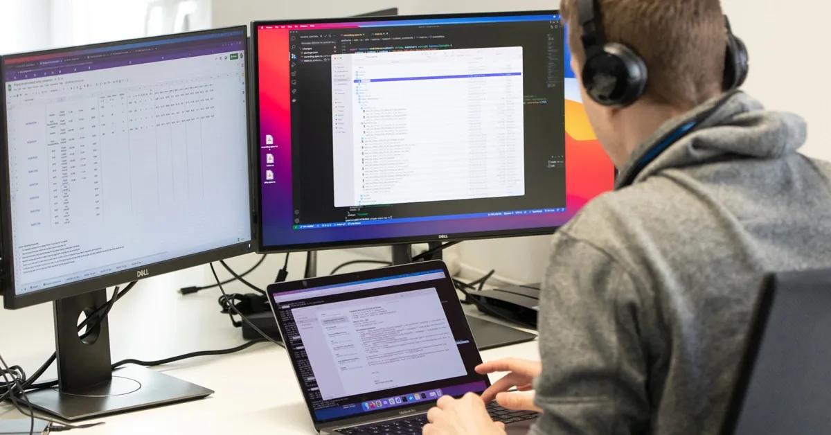 QA engineer performing unit testing and integration testing on multiple devices