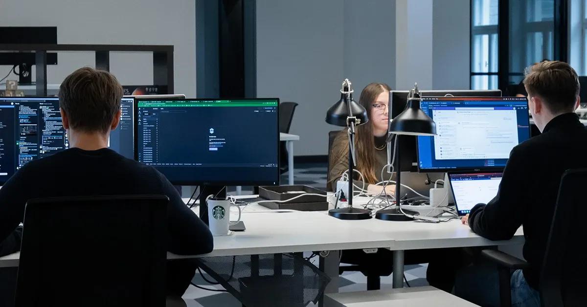 Software testers performing manual testing in office setting