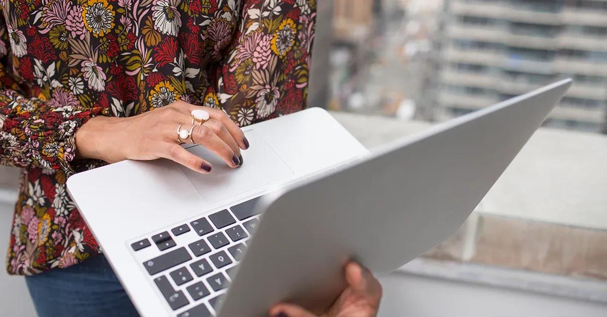 Woman holding a laptop