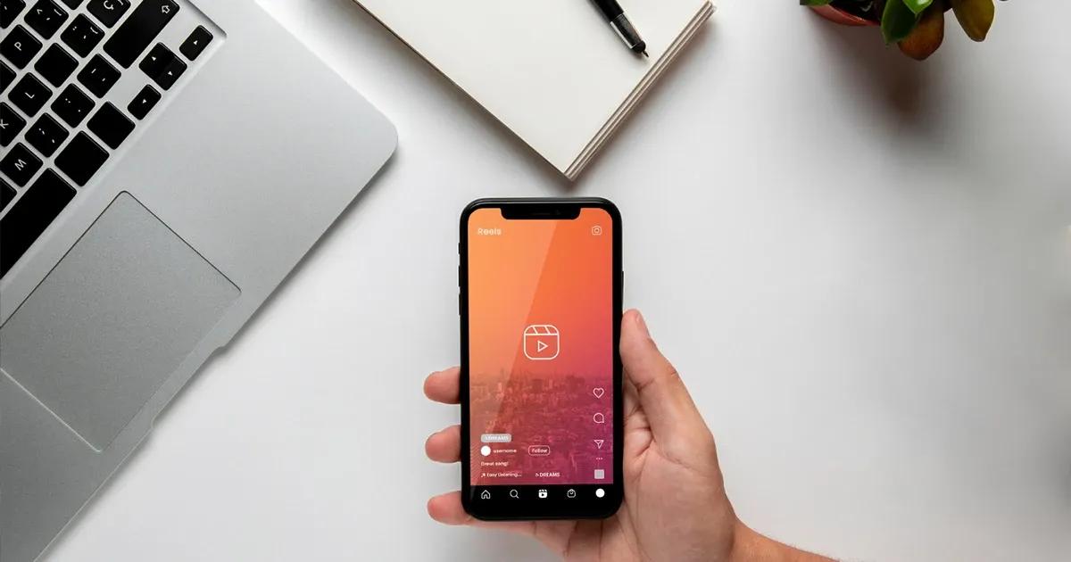 Man holding a smartphone, starting a short video app.