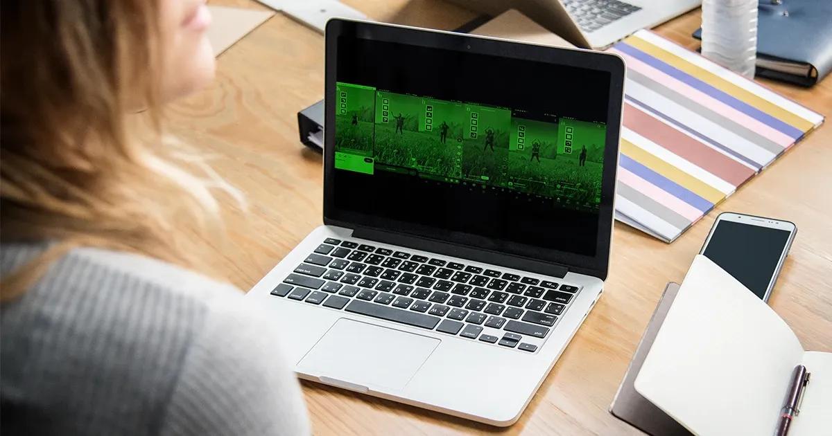 Woman looking at videos on her laptop.