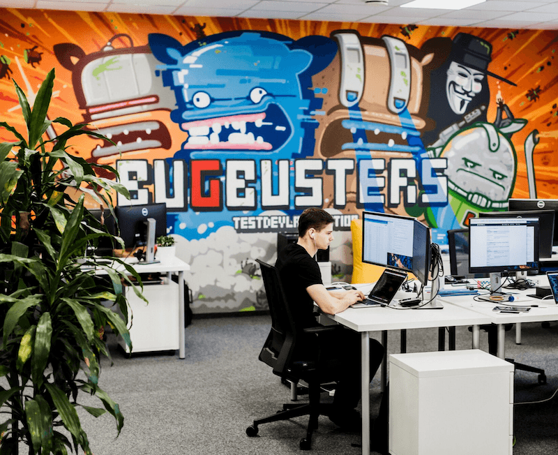 TestDevLab QA engineer working in our office